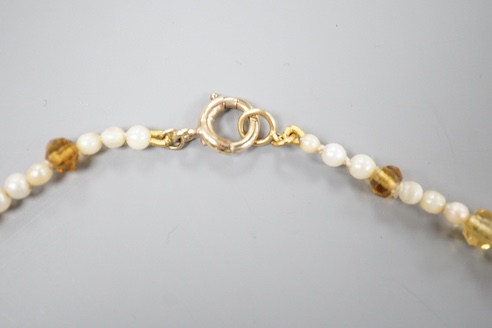 A single strand oval cut citrine and seed pearl set fringe necklace, with 9ct clasp, 44cm